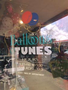 Balloons and Tunes store front window