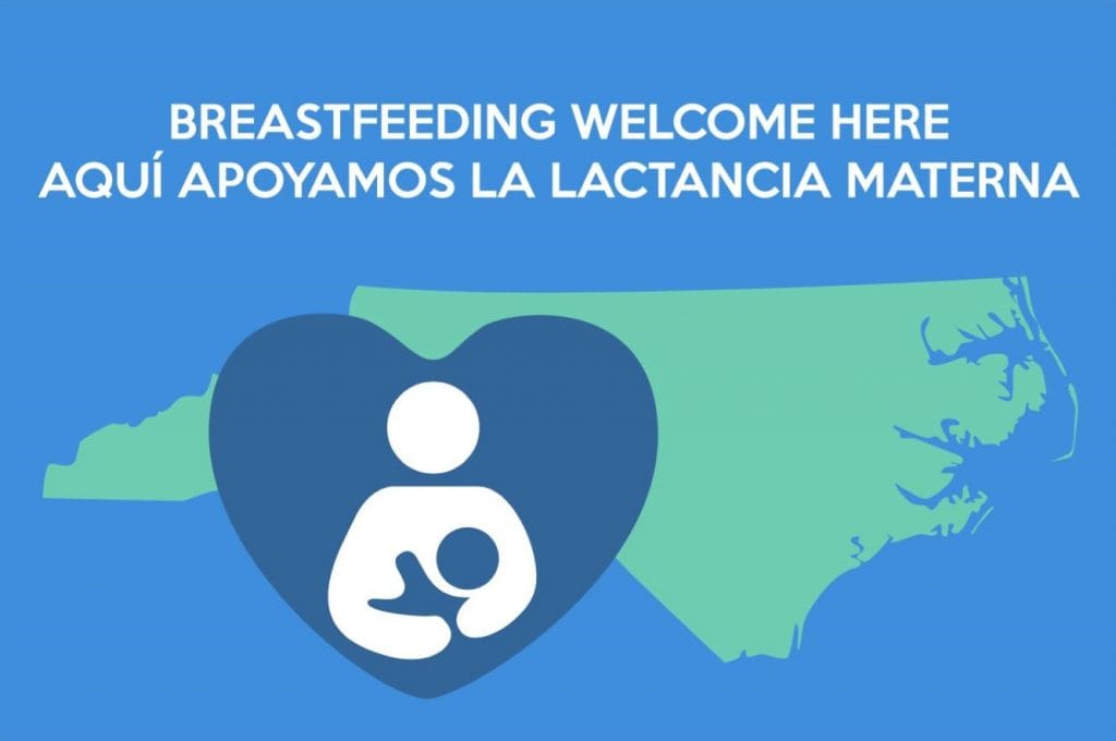 International image of nursing couple inside a heart with the shape of North Carolina in the background. Text: Breastfeeding Welcome Here; Aquí apoyamos lactancia materna.