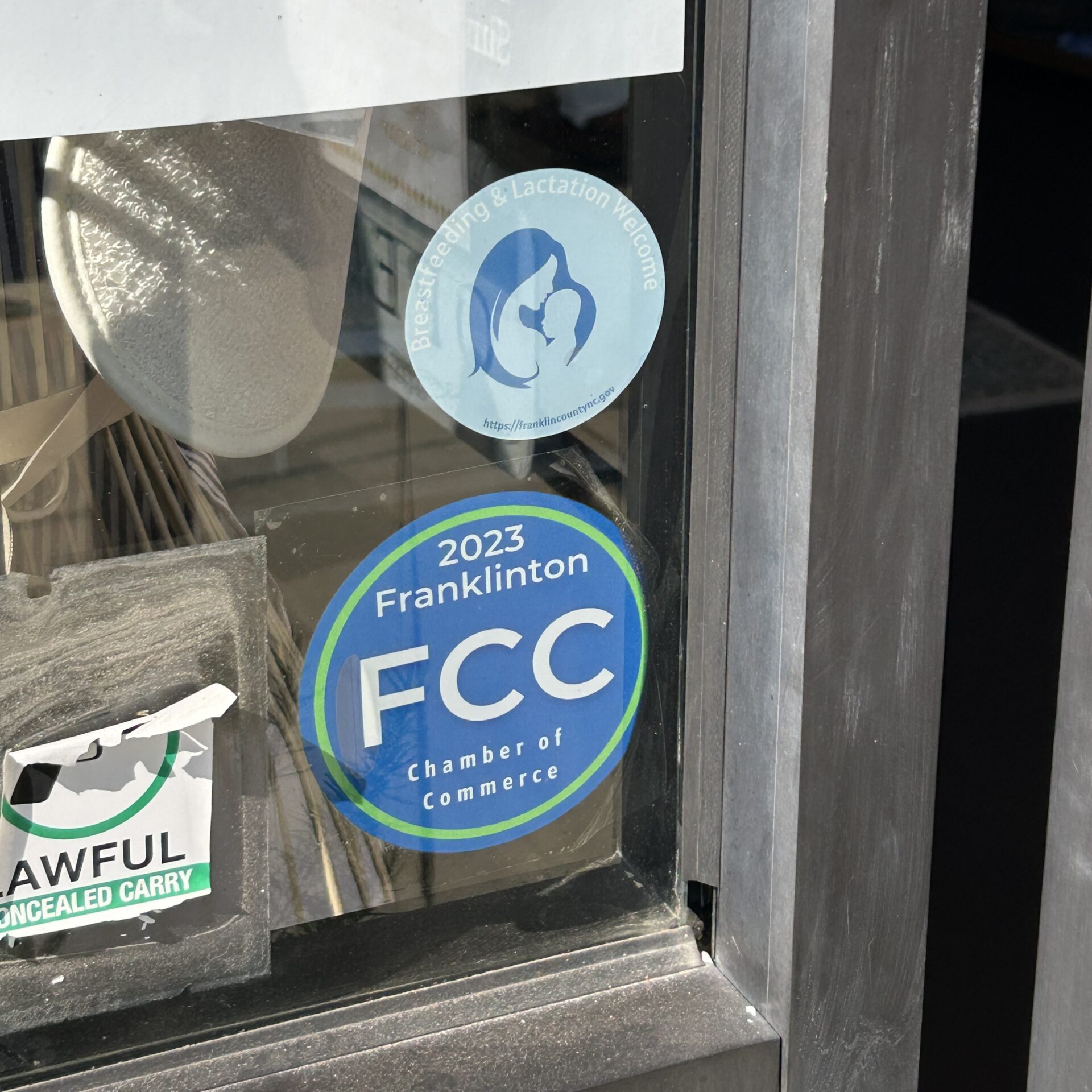 Breastfeeding and Lactation Welcome cling on a Franklinton storefront