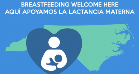 Nursing dyad inside a heart in front of the shape of North Carolina with the words Breastfeeding Welcome Here and Aquí apoyamos la lactancia materna.