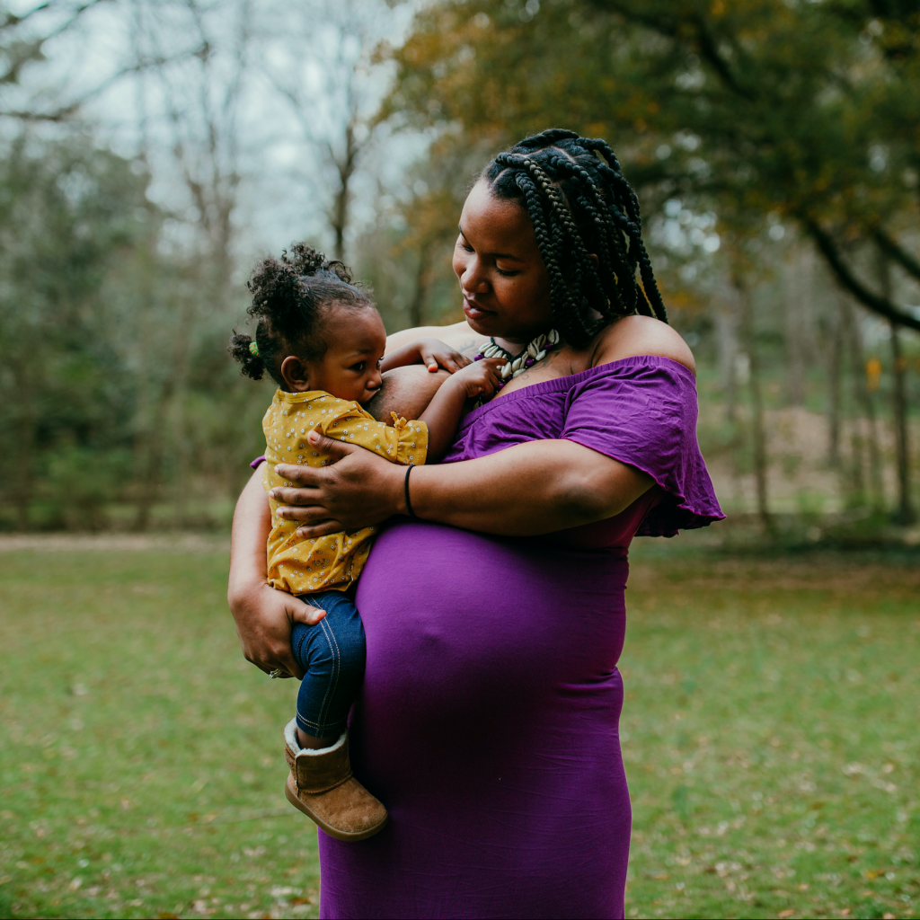 Woman holding her child and nursing